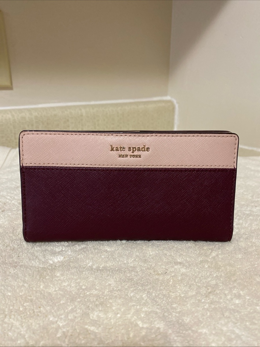 kate spade two-tone slim wallet in blush pink and wine